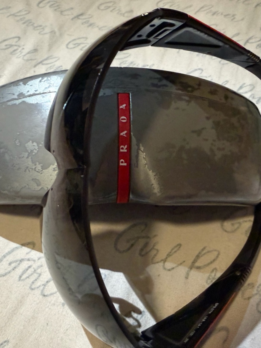 Prada Black Shield Sunglasses with Red Logo Stripe